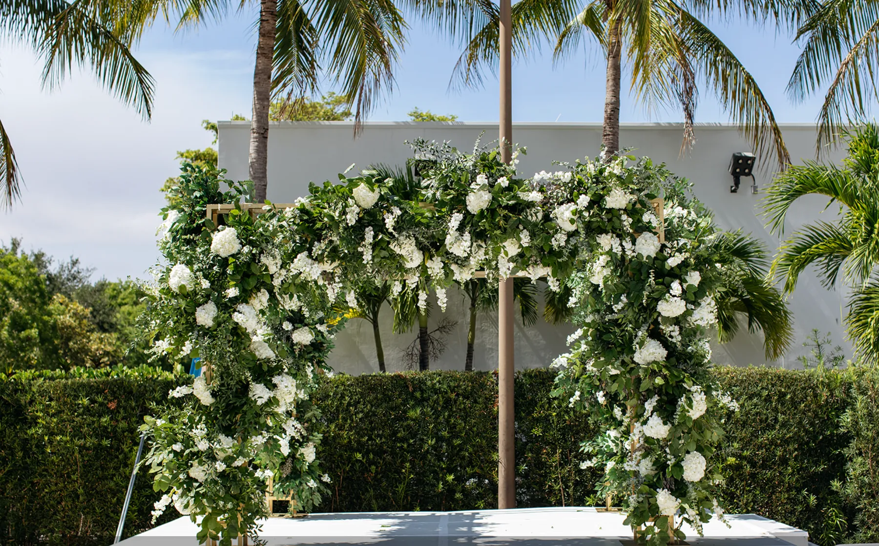 A wedding chuppah covered in white flowers